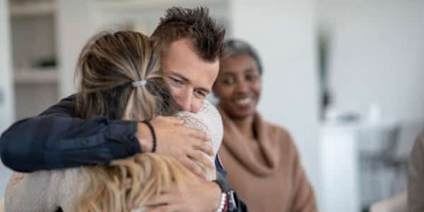 A guy hugging a girl