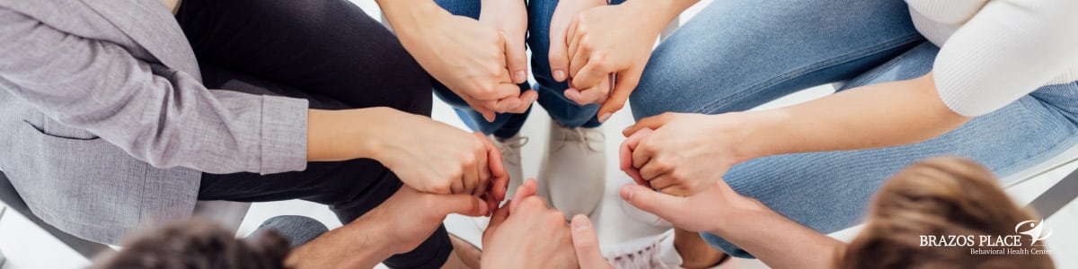 Group of people holding hands
